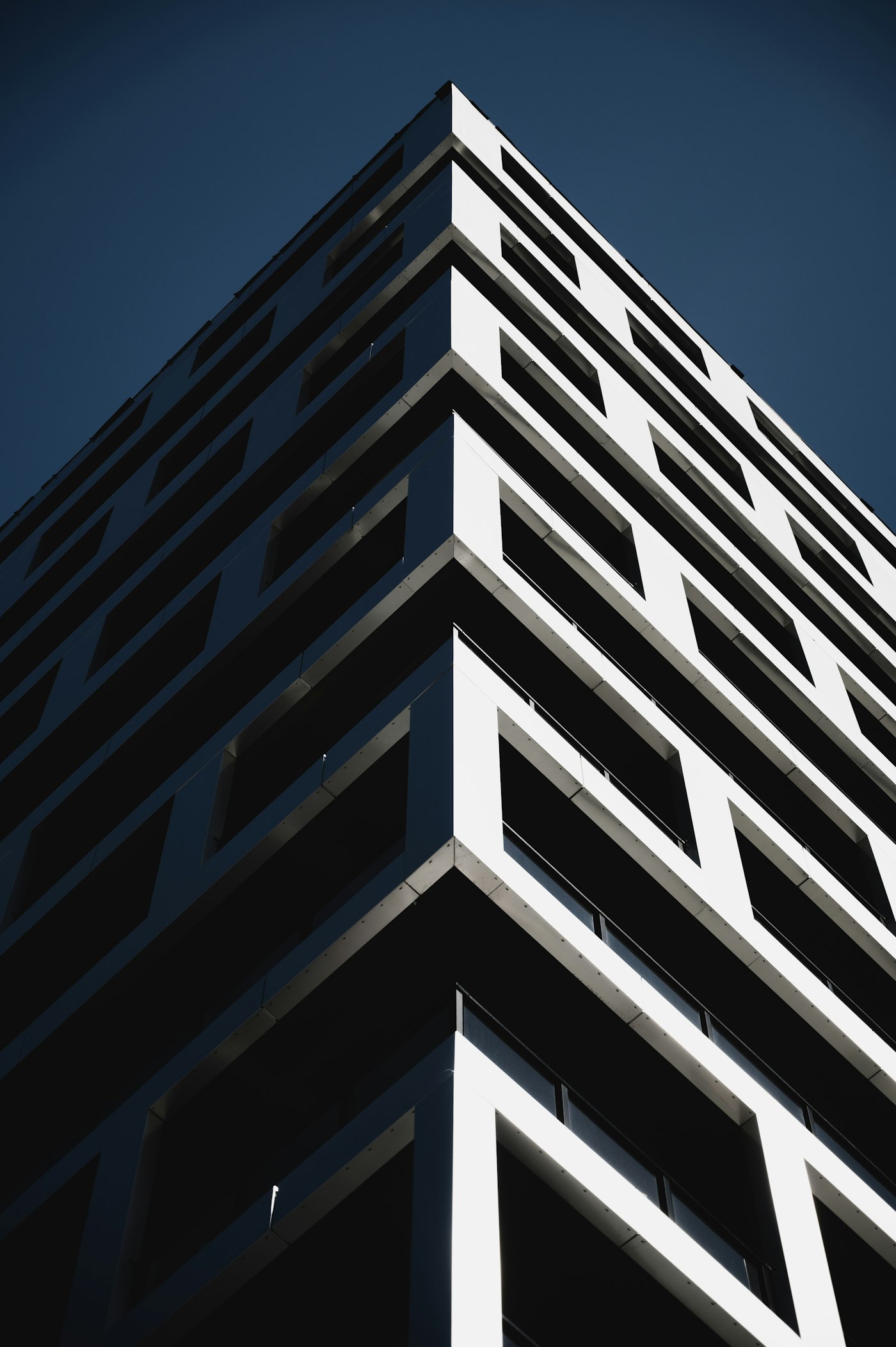 Modern residential high-rise tower with a glass façade in a Bolivian city